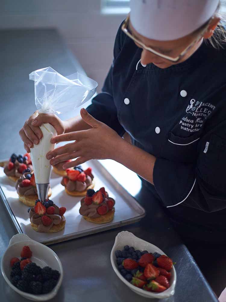 culinary student icing fruit
