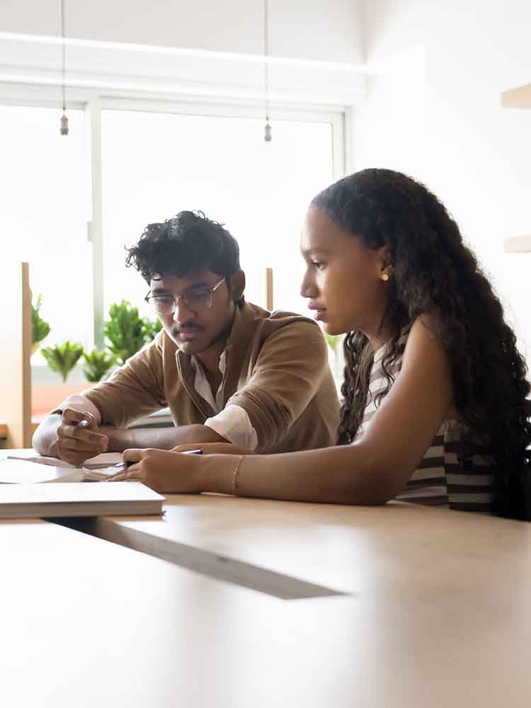 two people working together