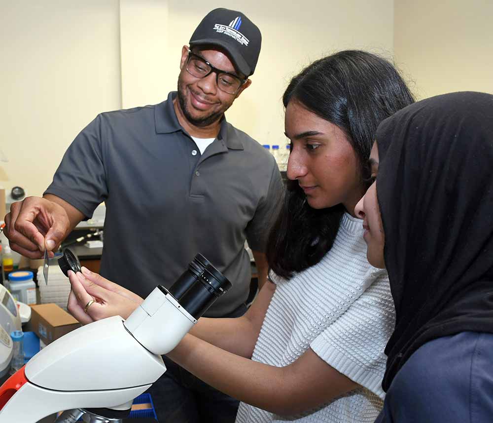 San Jacinto College students and faculty team in the lab working on research for the Student Spaceflight Experiments Program, preparing to send experiments to the International Space Station